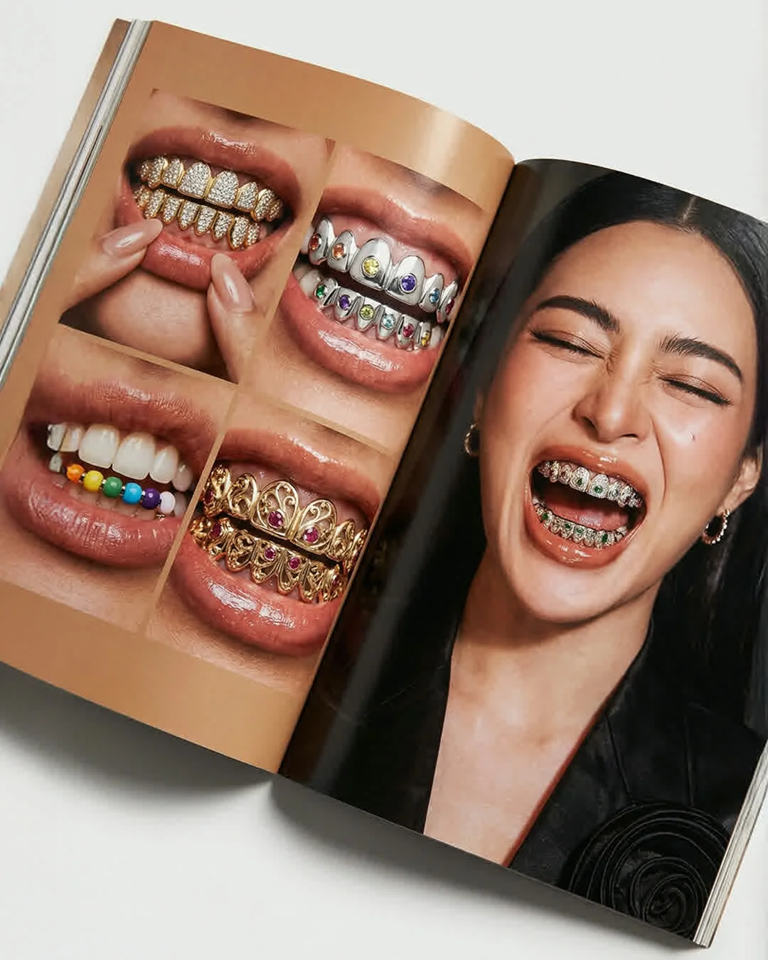 Open magazine featuring jeweled grillz and a smiling model